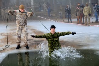  Canadian and American soldiers train in freezing water in Latvia