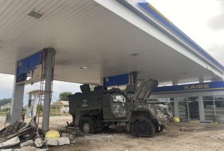 The photo shows the destroyed russian tank